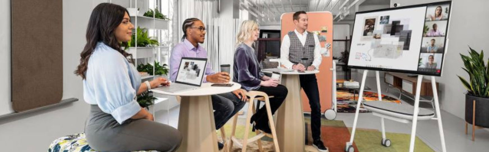 Office workers utilising modern technology video conferencing for collaboration