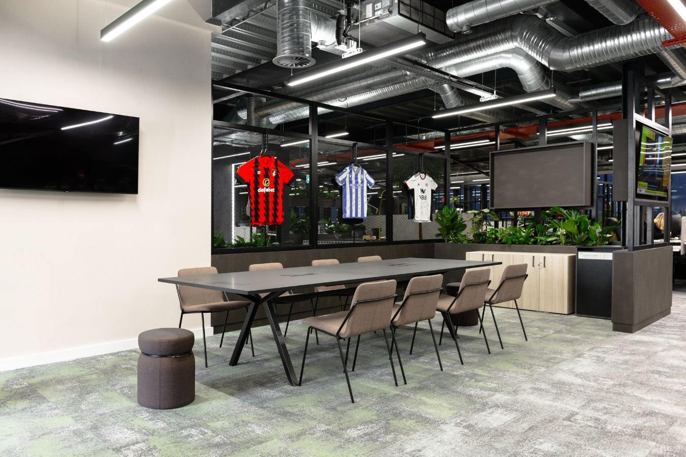 Modern breakout seating with technology space in sports business office
